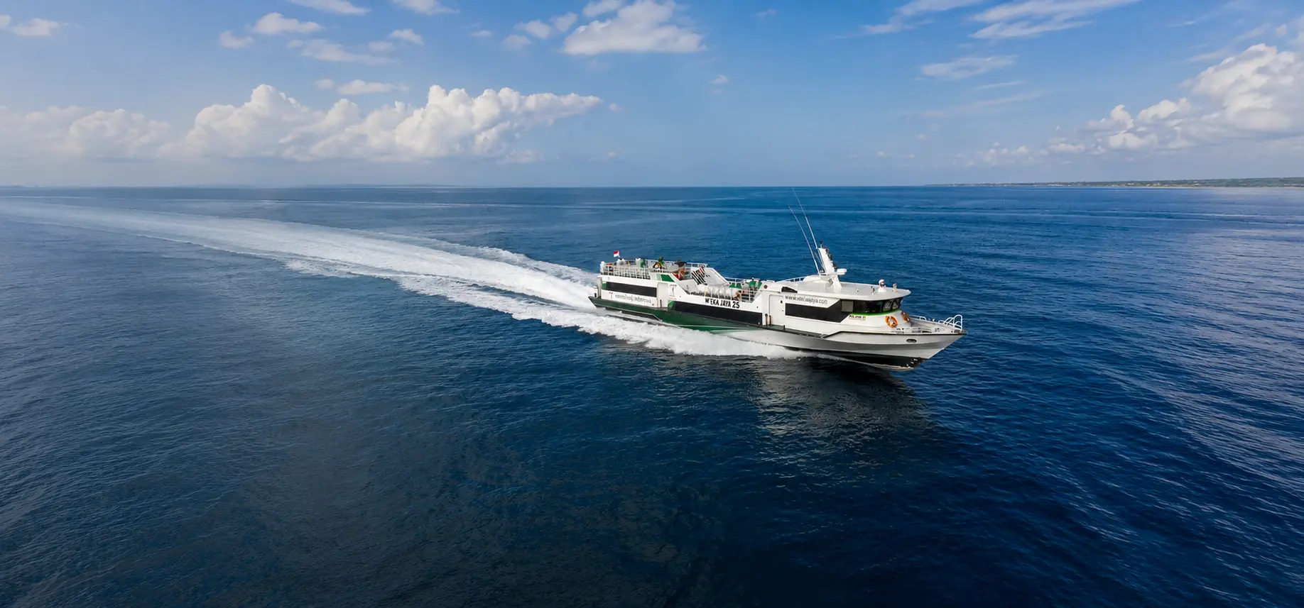 Fast boat sailing from Bali to the Gili Islands across calm blue sea